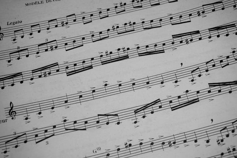 Detailed view of sheet music featuring musical notations and symbols.