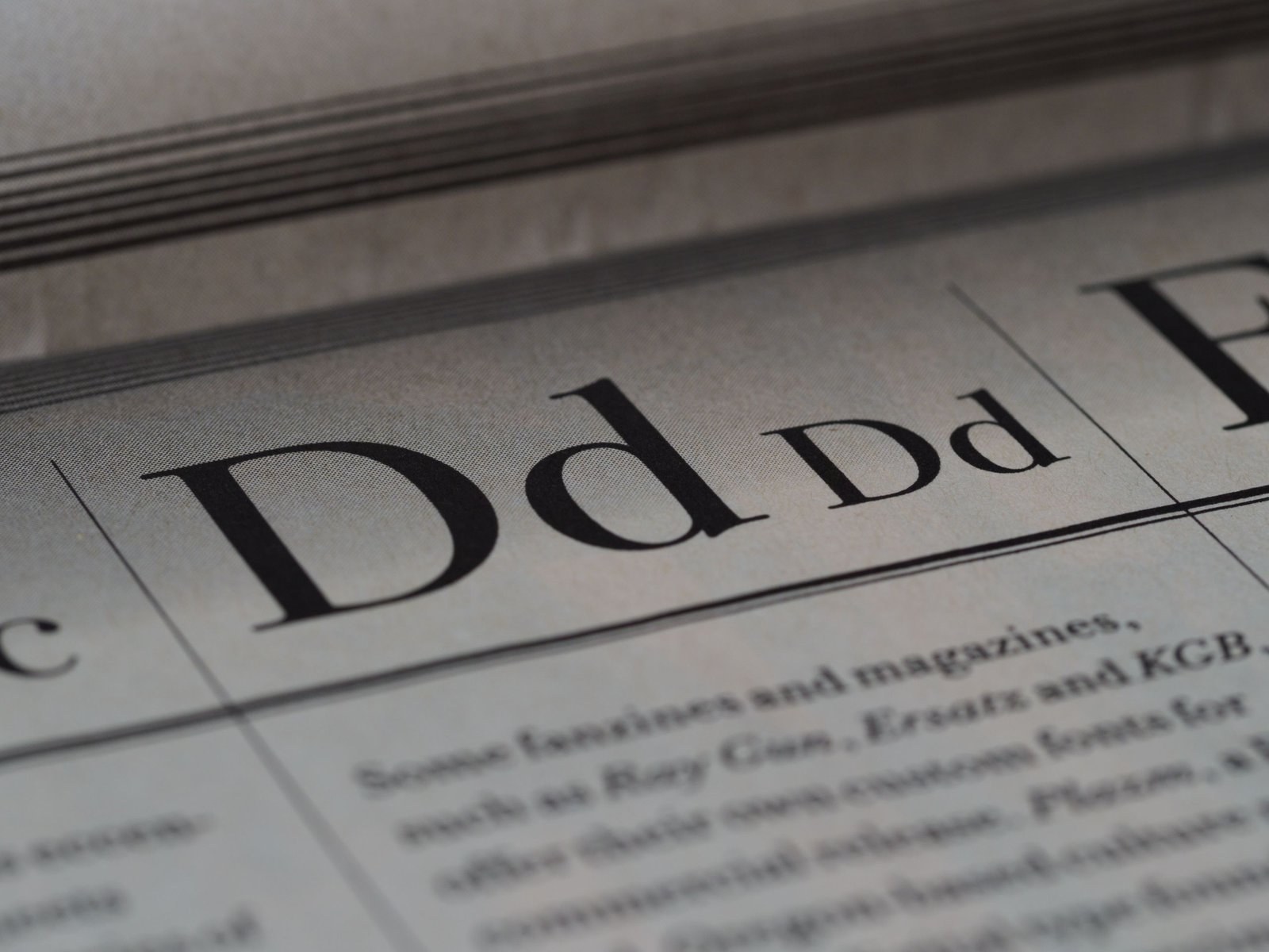 Detailed close-up of a newspaper showing typography and lettering design.